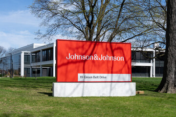Naklejka premium Toronto, Ontario, Canada - April 26, 2026: A Johnson and Johnson company ground sign in front of the building on Green Belt Drive in Toronto, Ontario. Johnson and Johnson is an American pharmaceutical