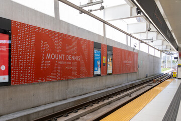 Naklejka premium Toronto, ON, Canada - May 4, 2026: The ttc logo on the building at Mount Dennis Station on the Eglinton Crosstown LRT (Line 5) in Toronto. Mount Dennis Station is an intermodal terminal serving GO Tra