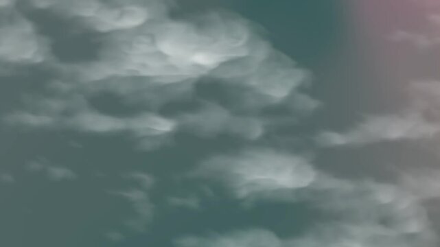 Dark and light clouds contrast in a colorful sky, perfect for dramatic backgrounds in design projects, presentations, or print materials.