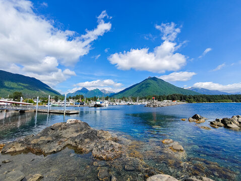 Sitka, Alaska - USA - August 3, 2024 - Scenic view of harbor with mountains and blue sky