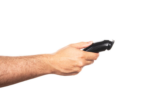 Hair trimmer in hand isolated on the white background. 