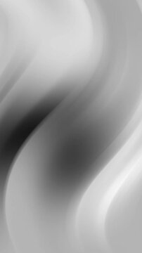 Grayscale abstract image with soft blurred waves and gradients. Perfect for design projects, backgrounds, and artistic concepts needing subtle textures.