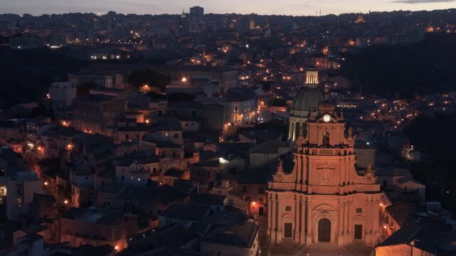 closer evening flying counter clockwise view of historic Ragusa Sicily