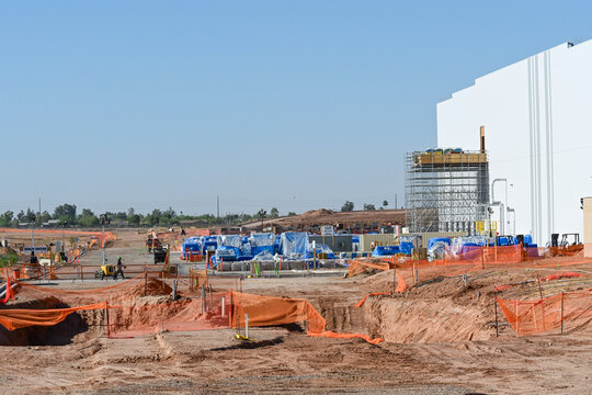 Construction site at a large battery manufacturing plant with excavation and infrastructure work underway, illustrating advanced manufacturing, industrial development, and energy technology