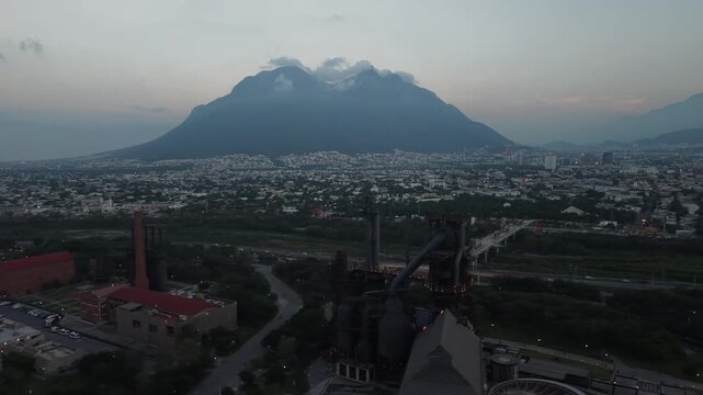 Drone Orbit Over Parque Fundidora and Cerro de la Silla at Dusk