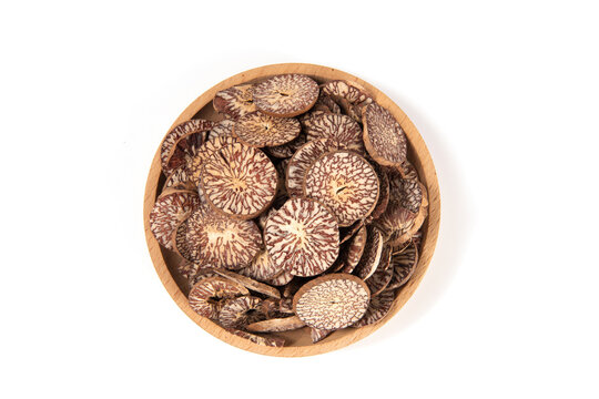 Dried sliced betel nuts on white background, top view