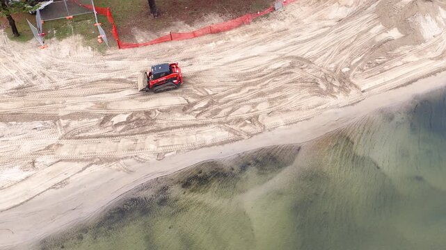 Aerial View of Excavator Leveling Sand on Gold Coast Canal Beach