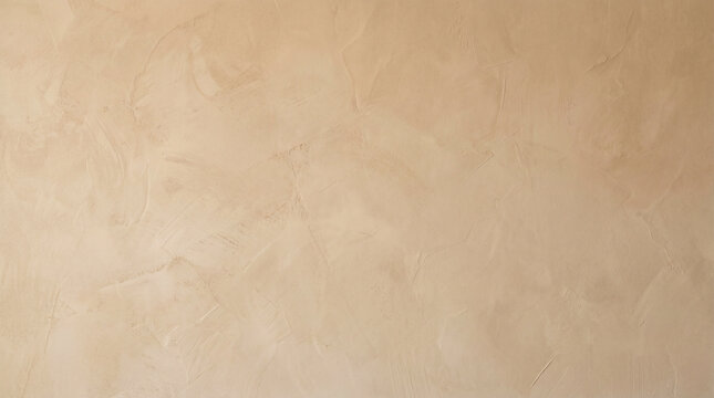 A close-up view of a light beige or tan textured wall surface, possibly stucco or Venetian plaster, providing a neutral background.