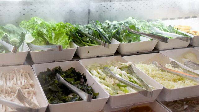 Fresh Vegetables and Ingredients at a Steaming Buffet Salad Bar
