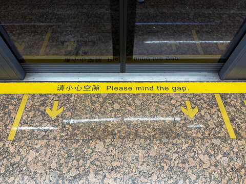 Close Up of Subway Platform Mind the Gap Safety Sign