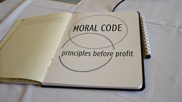 Open Notebook Displaying 'Moral Code Principles Before Profit' Concept