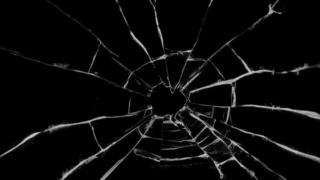 Shattered and broken glass shards cracked screen effect with intricate jagged fractures and a clean dark background,