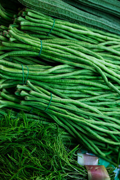 Long Beans And Climbing Wattle Leaves On Fresh Vegetable Stall