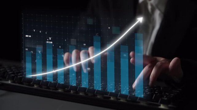 A business professional evaluates financial metrics and growth trends through a digital interface with graphs and currency symbols in a contemporary office setting. Copula