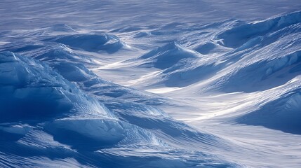Fototapeta premium Aerial view of pristine snow covered landscape in arctic environment.