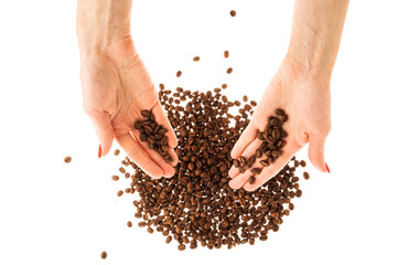 Fototapeta premium Woman's hands with red nails holding coffee beans.