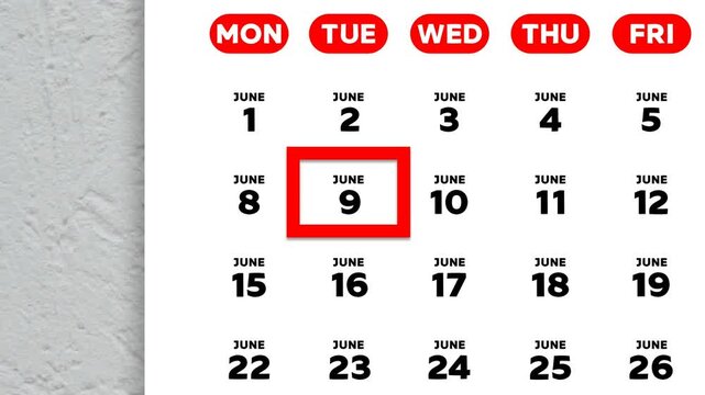 The date June 9th marked with a red cursor on the wall calendar 2026