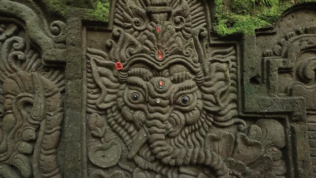Elephant head carved and decorated in stone, a traditional ancient craft in Bali