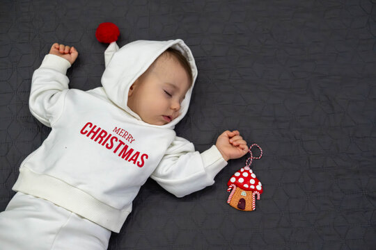 Cute Sleeping Baby in Christmas Outfit
