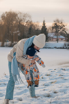 Portrait of Mother and Baby in Winter Wonderland