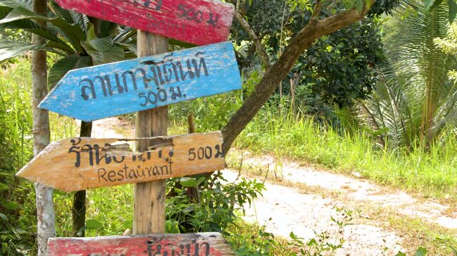 Wooden Directional Signpost on a Tropical Nature Trail in Krabi Thailand