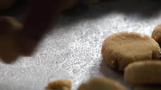 Preparing traditional Indian sweet dish peda by hand.