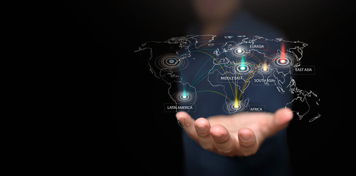 Hand holding digital world map with regional power centers and network lines. Fragmented multipolar world, power shift, geopolitical influence, economic change and international strategy concept.