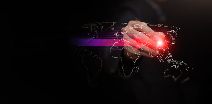 Hand with stylus pointing to glowing China on digital world map with arrow. Power shift from West to East. Rising Asian influence, geopolitical change, and economic realignment concept and strategy.