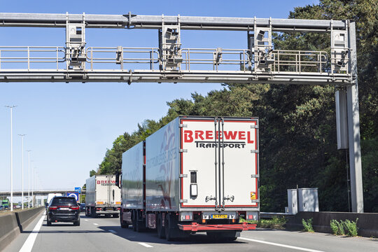 Antwerp, Belgium, May 01 2026. Overhead highway gantry equipped with ANPR tracking and speed cameras monitoring traffic and logistics trucks.