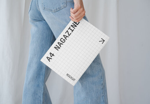 Mockup Of Woman Carrying Customized A4 Magazine