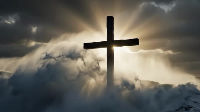 A large wooden cross standing in the snow with sun rays shining through