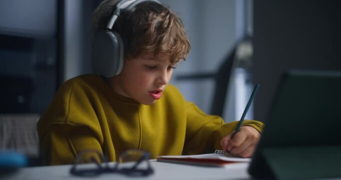 Child Studies Attentively At Home. Youthful Individual Focuses Intently On Language Learning Activities
