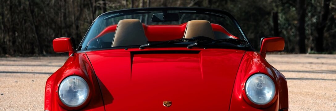 1988 Porsche 911 Speedster, Legend, red retro sports car.