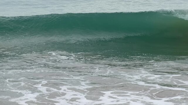 Front on view of ocean waves building and breaking in Port Elliot South Australia in 4k video footage