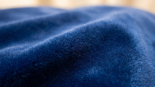 Close-up of soft blue velvet fabric with folds and texture