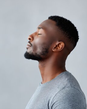 Man practicing breathing exercise, mindfulness concept