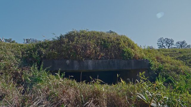 A view of the earth-covered powder magazine ruins, built directly into the fortress embankments to ensure the safe storage of gunpowder during the Edo period.
