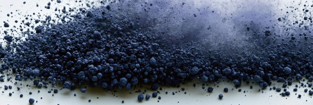 Dark blue pigment powder scattered and dusting on surface