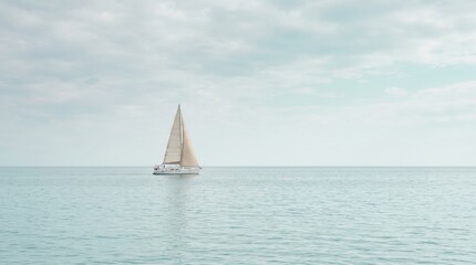 Fototapeta premium Minimal Sailboat on Calm Sea for Coastal Travel Background with Wide Blue Horizon