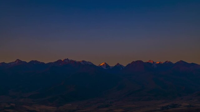 cloudless sunrise above mountains time lapse at summer in Kyrgyzstan