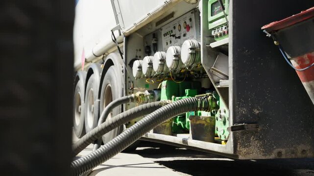 Truck tanker supplies airplane with kerosene at airport during global crisis