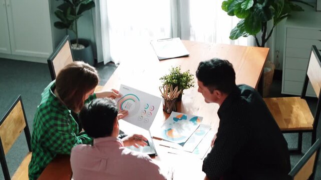 Top view of caucasian businesswoman compare two financial graph to investor. Attractive project manager present and sharing marketing idea to business team while show stock market chart. Convocation.