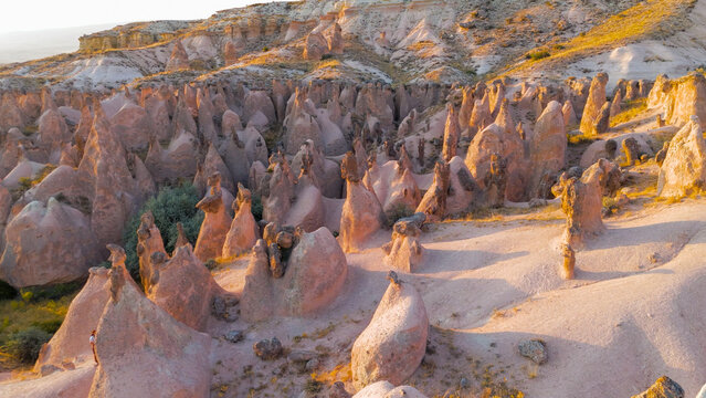 Goreme, Nevsehir, Turkey. Fantasy landscape of Devrent Valley with alien-like rock formations and surreal colors during evening hours.. Aerial View