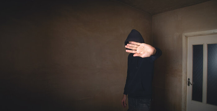 Caucasian sad man making stop gesture.