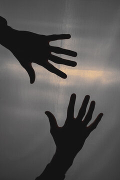 Silhouette of male hands. Dark view