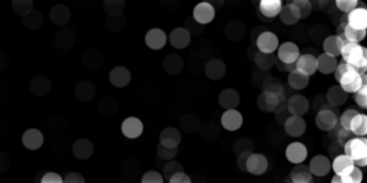 Black background with white bokeh lights and smooth blur effect.