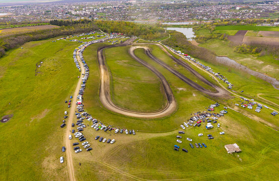 AutoCross Race on Dirt Track Seen from Above, Aerial Sports Concept with Racing Cars and Dust Clouds, Drone View of Off-Road Competition