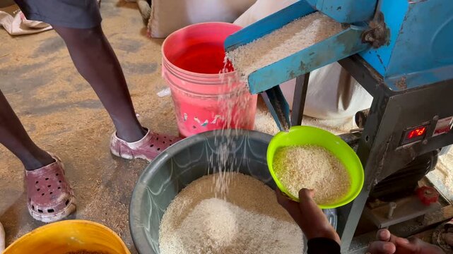 Small-scale rice milling machine in operation in Salima, Malawi.