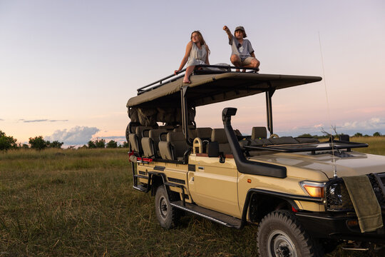 family on mobile safari, Okavango Delta, Botswana, Africa