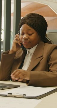 Focused office multitasking. Manager reviews documents while working